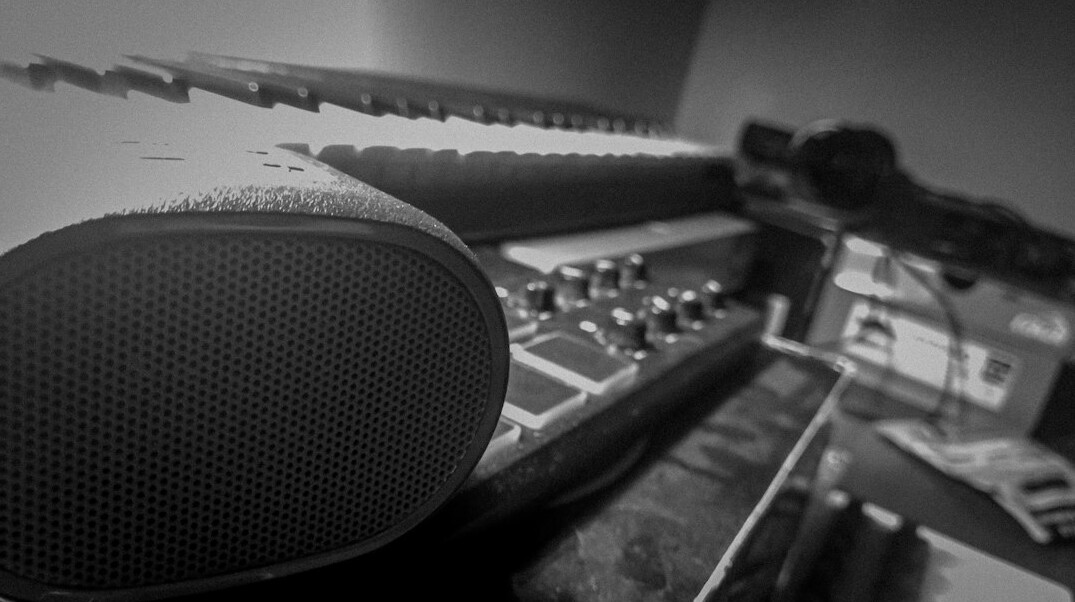 Home recording studio with mixing console and acoustic panels